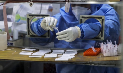 A health worker collects swab samples at a hospital in Mumbai. It is not clear whether the B.1.617 variant is helping to fuel the current surge in India.