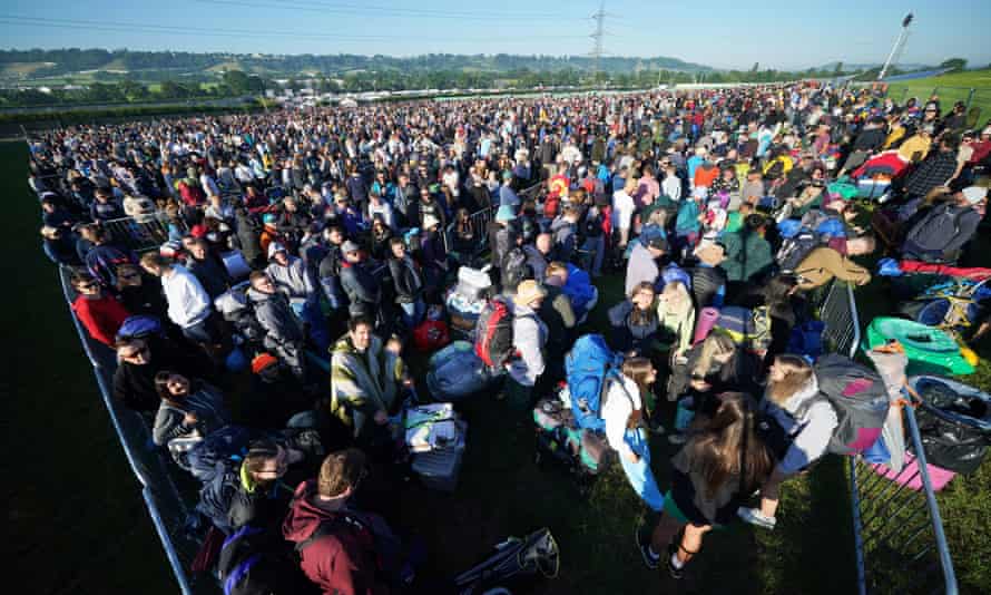 People queue for entry on the first day of the festival.