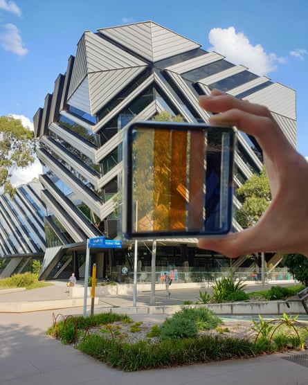 A prototype semi-transparent solar cell in development as an alternative to window glass.