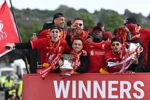 Jota holds the FA Cup during an open-top bus parade to celebrate Liverpool’s domestic cup double in 2022