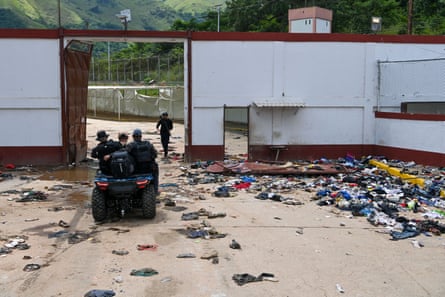 people on motor bike leaving the prison