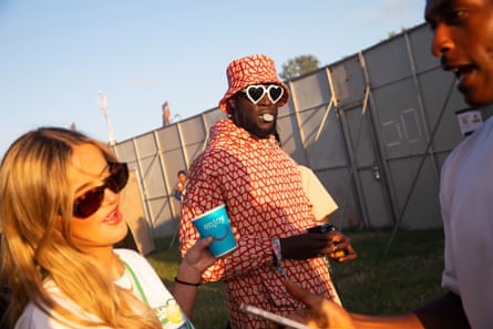 Stormzy watching D-Block Europe and taking photos of the crowd at Other stage.