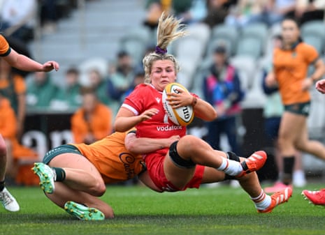 Alex Callender is tackled in the women's Test between the Wallaroos and Wales