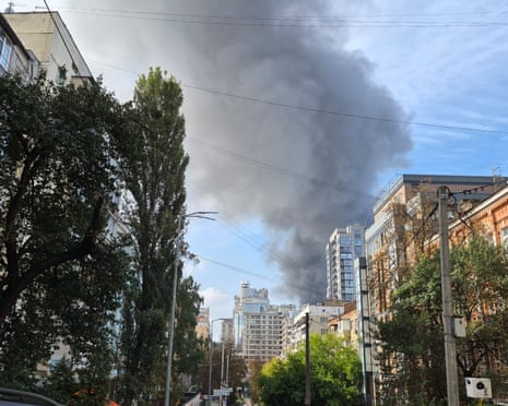 Smoke rises above buildings in the city center following a Russian shelling attack on Kyiv, Ukraine.