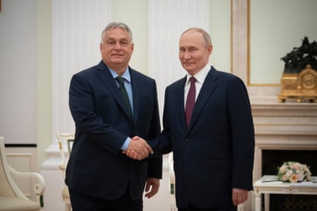 Vladimir Putin shaking hands with Hungarian Prime Minister Viktor Orban during their meeting in the Kremlin