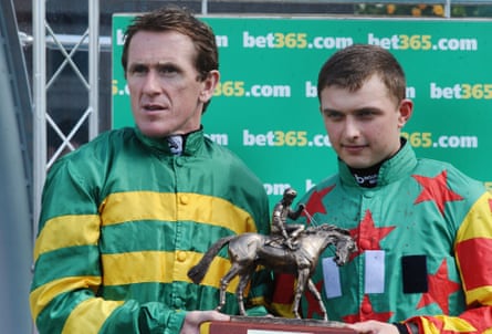 AP McCoy presents Sean Bowen with the award for champion conditional jockey at Sandown in 2015.