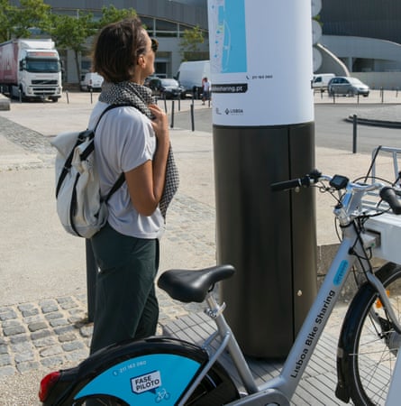 A user gets ready to hire one of Lisbon’s new e-bikes.