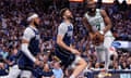 Boston Celtics guard Jaylen Brown, right, attempts a shot during his team’s NBA finals Game 3 meeting with the Dallas Mavericks