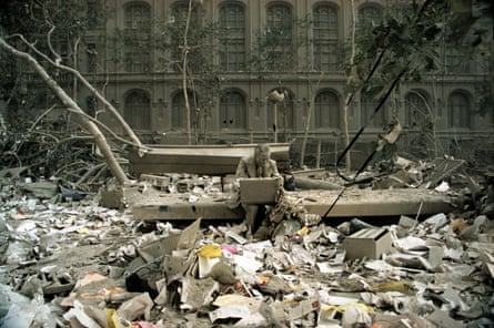 Lifesize sculpture of a man sitting in Liberty Plaza, New York, surrounded by dust and debris from the 9/11 attacks