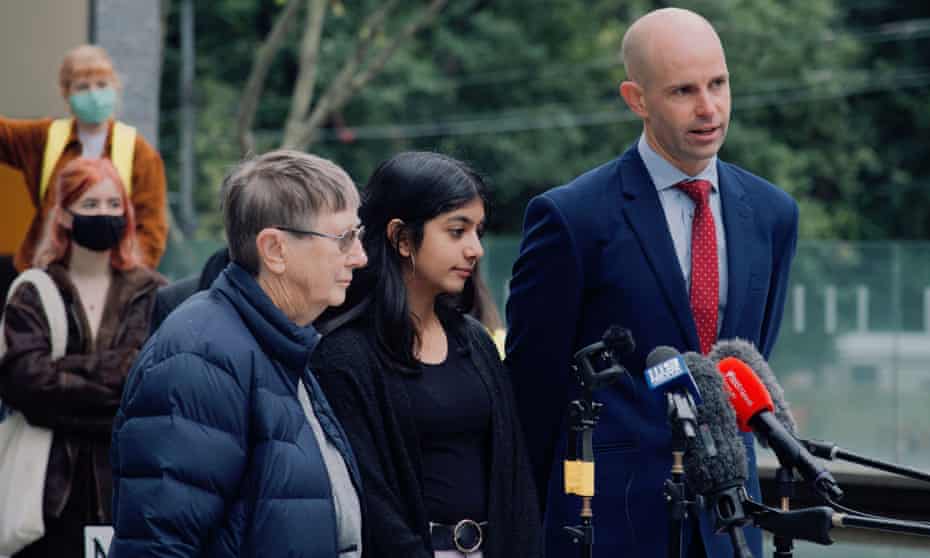 School student Anj Sharma outside the federal court in Melbourne, with lawyer David Barnden and Sister Brigid Arthur.
