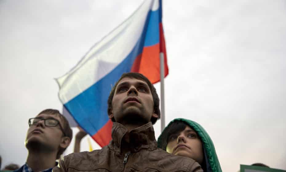 A young couple attend an opposition rally in Moscow
