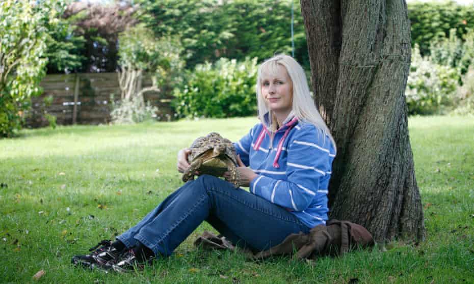 Photograph of Janine Calzini holding tortoise Bertie