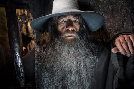 Close up of Sir Ian as Gandalf with a grey hat and holding his staff