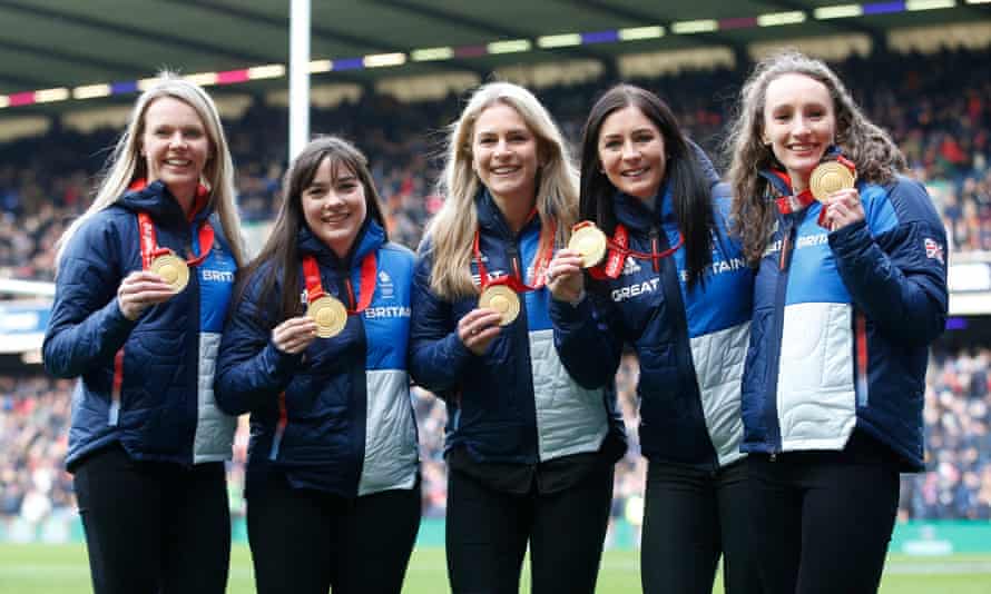 Great Britain’s women’s curlers Mili Smith, Hailey Duff, Jennifer Dodds, Vicky Wright and Eve Muirhead with their Olympic medals