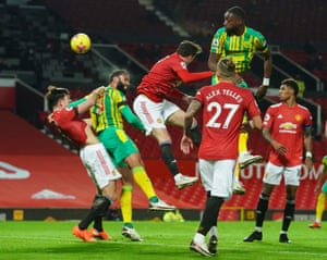 Kyle Bartley of West Bromwich Albion (second left) heads at goal.