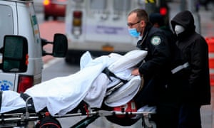 A patient is transported outside of Tisch hospital in New York on 13 November
