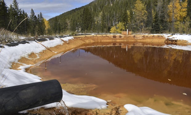 Water contaminated with arsenic, lead and zinc flows from a pipe out of the Lee Mountain mine and into a holding pond near Rimini, Montana, part of the Upper Tenmile Creek Superfund site.