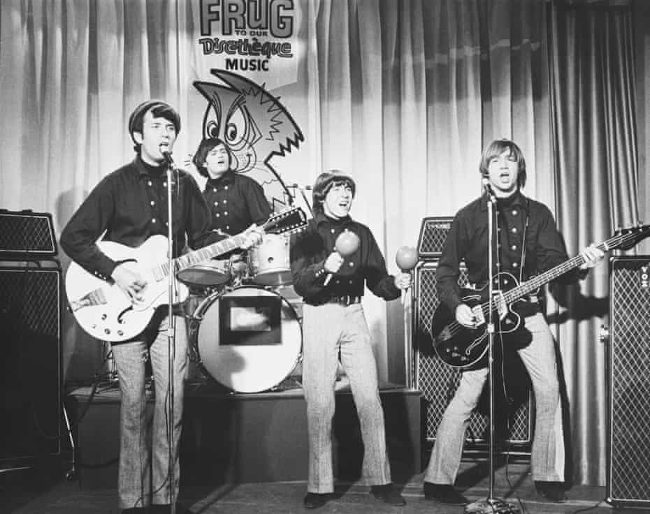 Peter Tork, far right, performing with the Monkees, from left, Michael Nesmith, Micky Dolenz and Davy Jones, in the 1960s.