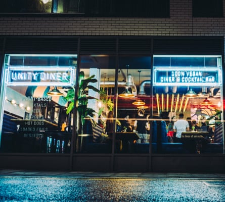 The Unity Diner at night, with electric neon signs