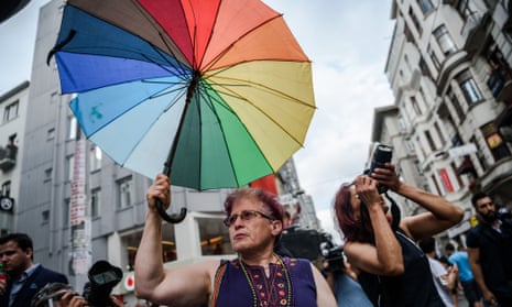 A woman holds a rainbow umbrella at an LGBT rally on Istiklal avenue in Istanbul on 26 June, where riot police fired teargas and rubber bullets to disperse protesters defying a ban on the city’s Gay Pride parade.