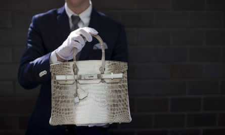 An employee holds a Hermes diamond and Himalayan Nilo Crocodile Birkin handbag at Heritage Auctions offices in Beverly Hills, California.