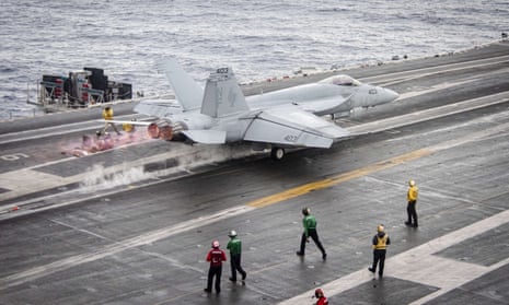 A US F/A-18E Super Hornet takes off from the flight deck of the aircraft carrier USS Ronald Reagan