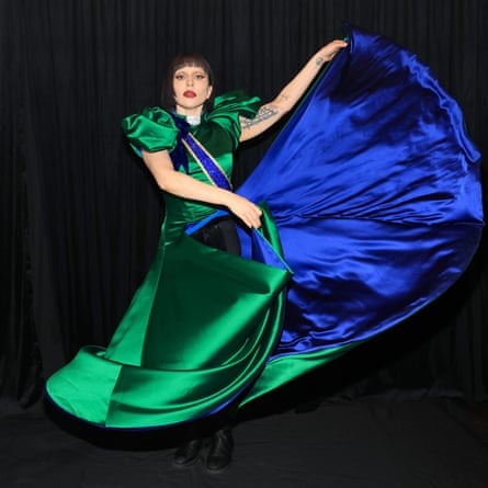 Lady Gaga swirling a green and blue satin dress.