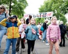 Dutch children are unusually happy and healthy. Is it because of the Avondvierdaagse? Once a year, Dutch kids, parents and teachers take part in a walking festival, heading out for four nights in a single week to explore their neighbourhoods, exercise and make friends. Its a tradition that seems to be genuinely transformativeI shouldnt have been surprised that the rain didnt stop the Dutch kids. All day it had been thunderstorming, and the forecast didnt look so great for the evening. And yet at 5pm, hundreds of kids started arriving – many by bike – with their parents to Amsterdams Westerpark, a beloved city park that caters to a more residential area of the capital. Today, it functions as a starting point: volunteers coordinate registration, and groups of children gather, decked out in raincoats and eager to embark on either a 5km or a 10km excursion around the surrounding neighbourhoods.Its the second night of Avondvierdaagse (which literally means four-day evening walk) , organised by a group of neighbourhood volunteers. Its not a race, but if children complete every night, they get medals, a bouquet of flowers and, if theyre lucky, a lot of sweets. Its not just Amsterdam; across villages, towns and cities in the Netherlands, hundreds of thousands of Dutch people are doing the same: every year, kids spend four evenings in early summer exploring their neighbourhoods with their school friends and parents as part of the Week van de Avond4daagse. Some places had celebrated earlier; others were walking the following week. A variation of the tradition has even made its way to Suriname, one of the Dutch former colonies. There are also four-day cycling and swimming events. According to the Royal Dutch Walking Association (KWbN), which helps coordinate the events, half a million people take part every year, in 700 locations across the country, powered by tens of thousands of volunteers. Continue reading...