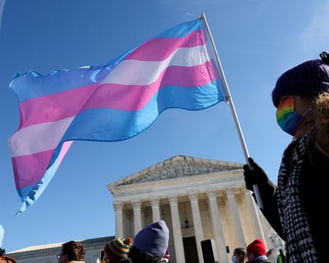 A transgender rights supporter takes part in a rally outside of the supreme court on 4 December 2024.