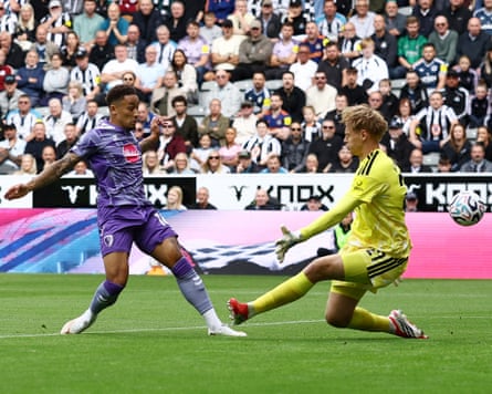 Bournemouth’s Marcus Tavernier dinks a finish past Lucas Hornicek to put his team 1-0 up against Newcastle