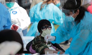 A Detroit resident is tested for coronavirus in Detroit, Michigan on Tuesday.