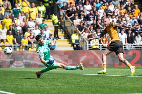Oliver McBurnie tucks the ball home to give Hull the lead against Norwich.