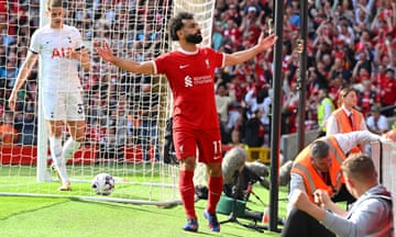Mo Salah celebrates scoring an early Liverpool goal in the Anfield sunshine.