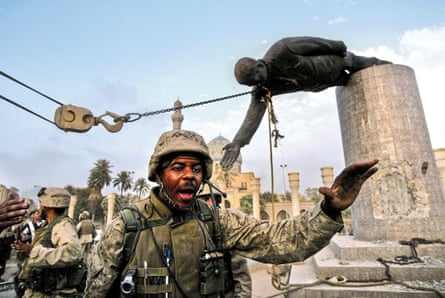 US Marines arrive to help Iraqi civilians pull down a statue of Saddam Hussein, Baghdad, Iraq, 2003