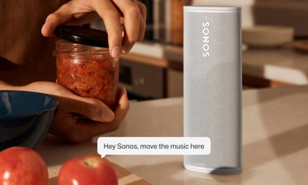 A caption showing the voice control feature being used on a Sonos Roam smart speaker.