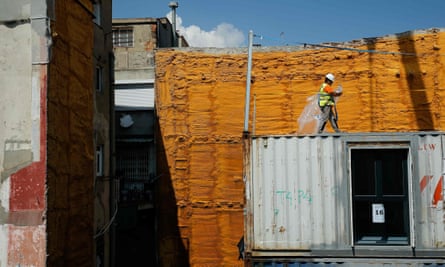 A worker walks on the construction site of the flats on Carrer Nou de Sant Francesc.
