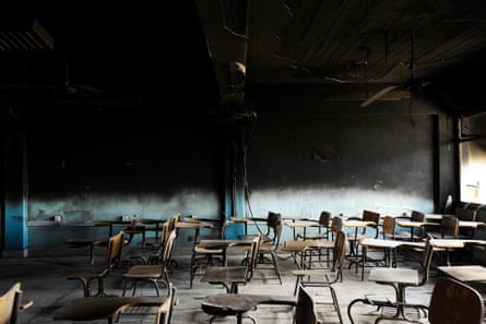 Burned out classroom, with writing tablet chairs still in place, Mosul, Iraq, 2017.