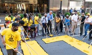 De Blasio, Al Sharpton and other volunteers paint a Black Lives Matter mural outside Trump Tower.
