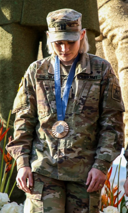 Sammy Sullivan successful her US service uniform, pinch her bronze badge from nan 2024 Paris Olympics.