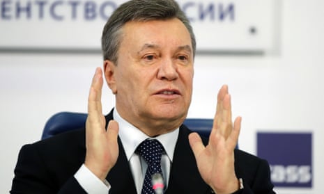 Viktor Yanukovych at a news conference in Moscow