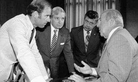 George Shultz, right, speaks with members of the Senate foreign relations committee including Joe Biden, left.