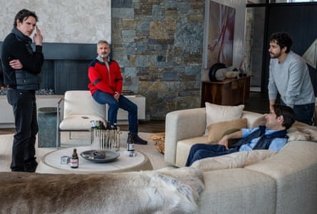 A group of four friends talk in a luxurious living room