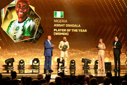Asisat Oshoala (second left) receives the Confederation of African Football’s women’s player of the year award in July 2022