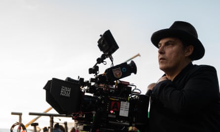 Joe Wright sits next to a camera during the shooting of a scene for M: Son of the Century.