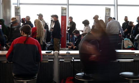 Travelers wait ahead of the Thanksgiving Holiday at St Louis Lambert international airport in Missouri on 22 November. 