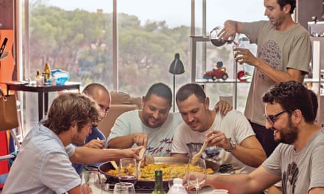 Matt Goulding (left) and friends share a paella. 