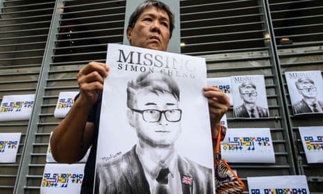 A protester holds an illustration of Simon Cheng during a gathering outside the British Consulate in Hong Kong. Cheng was released on Saturday.
