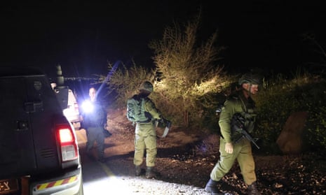 Israeli soldiers search for a rocket that landed in the annexed Golan Heights on Sunday. 
