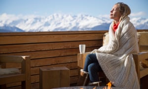 ‘Within the mountains, I really feel fully free’: how snow-capped peaks assist skiers actually unwind | Come residence to the slopes 2 Woman day dreaming at the terrace of a hotel