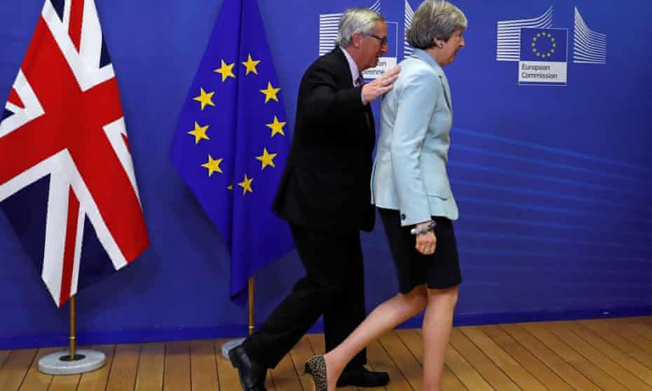 Theresa May with European commission president Jean-Claude Juncker in Brussels.